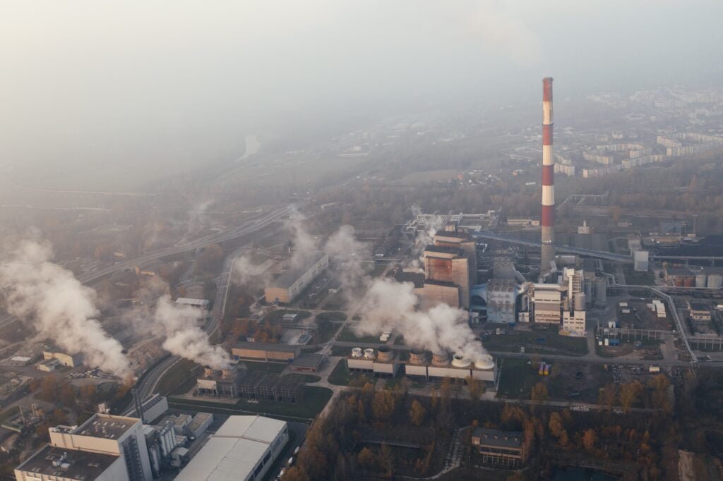 Factory Emitting Smoke And Contributing To Air Pollution Seen From Above.